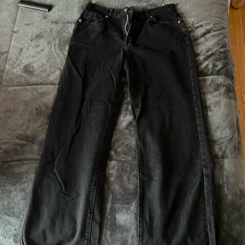 Black high rise jeans with butterfly’s on the back pockets